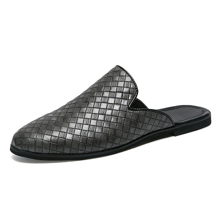 Black woven slip-on shoe on a white background