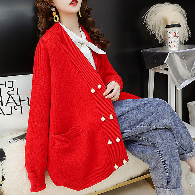 Cartoon female 2019 autumn and winter new Korean version of loose solid color pearl buckle thin knit sweater double buckle outer cassette tide