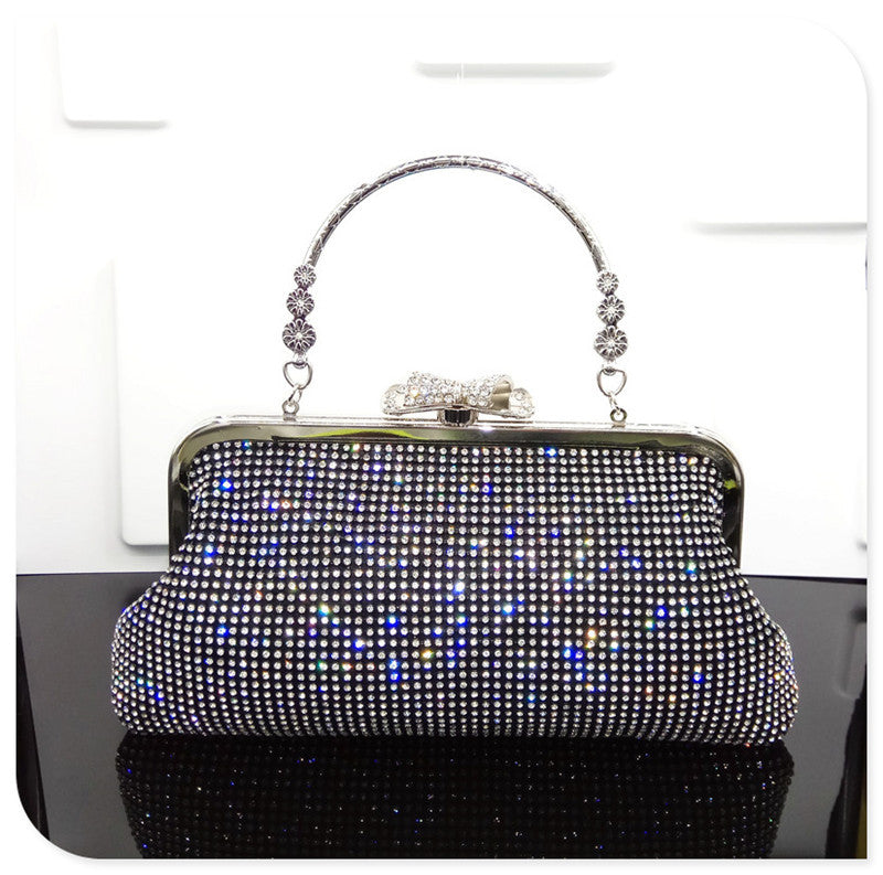 Sparkling handbag with rhinestone embellishments on a white background