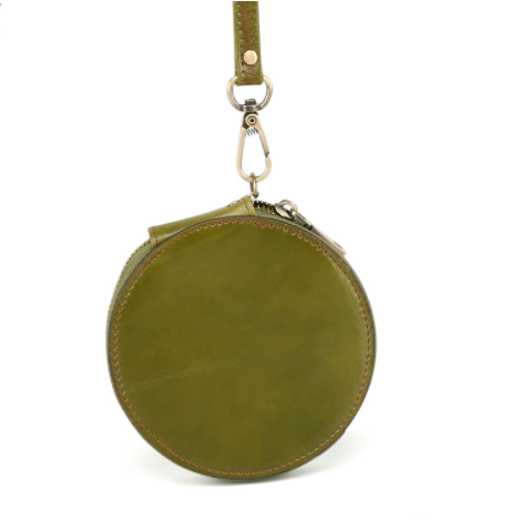 Green round leather pouch with a strap on a white background