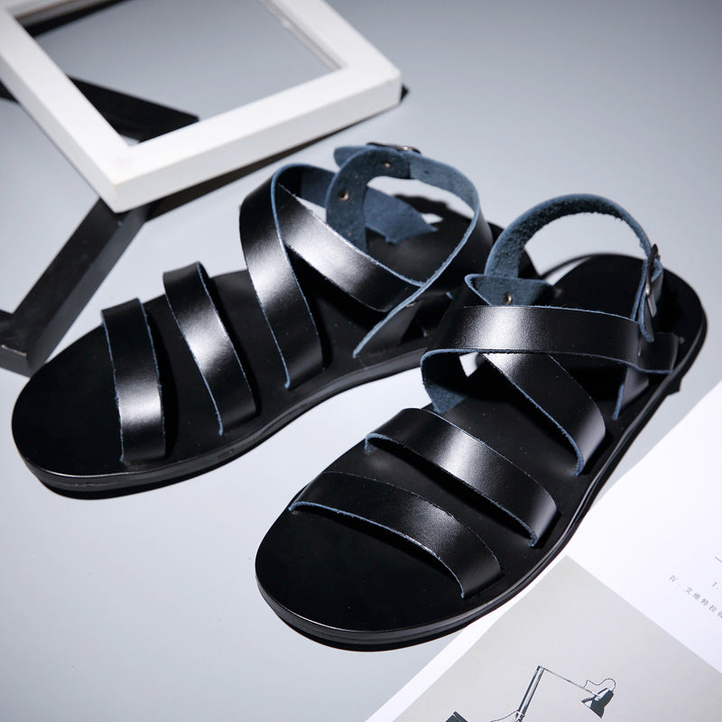 Black sandals on a light gray background