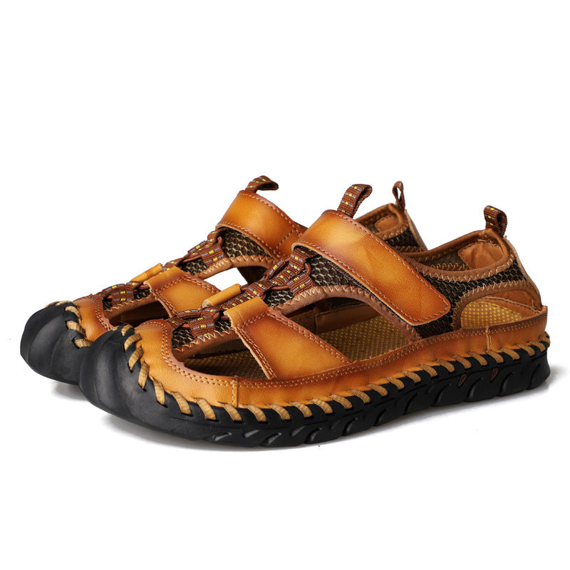 Pair of brown sandals with black soles on a white background