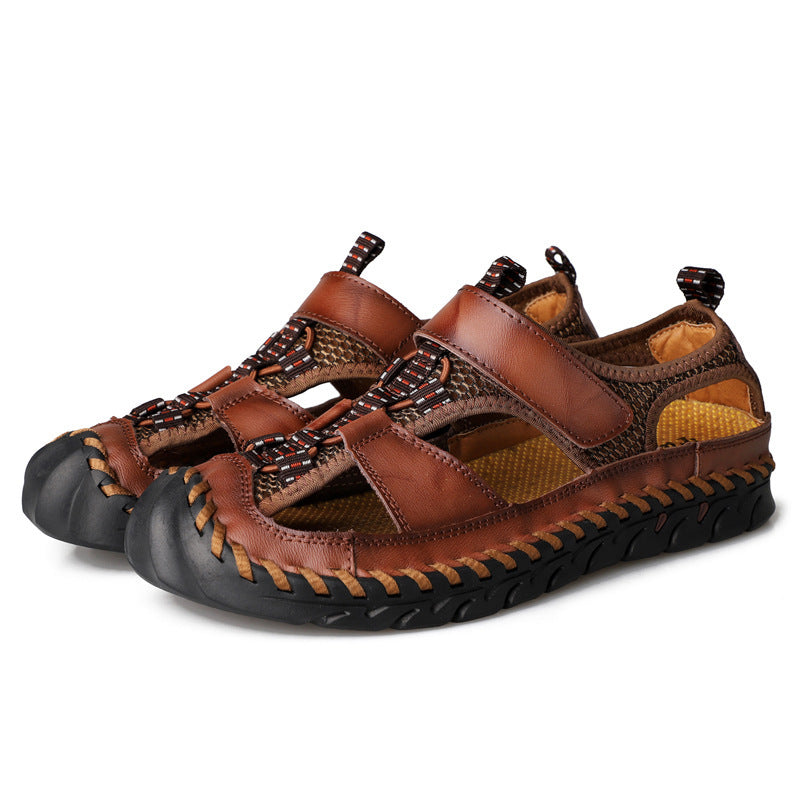 Brown sandals with black soles on a white background