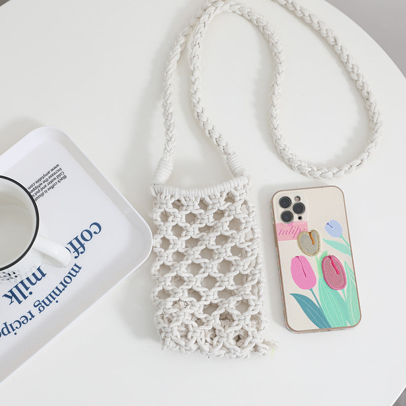 White lace phone pouch with a phone case featuring tulip designs on a white surface.