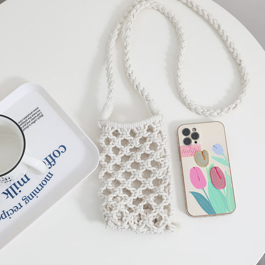 White lace phone pouch with a phone case featuring tulip designs on a white surface.