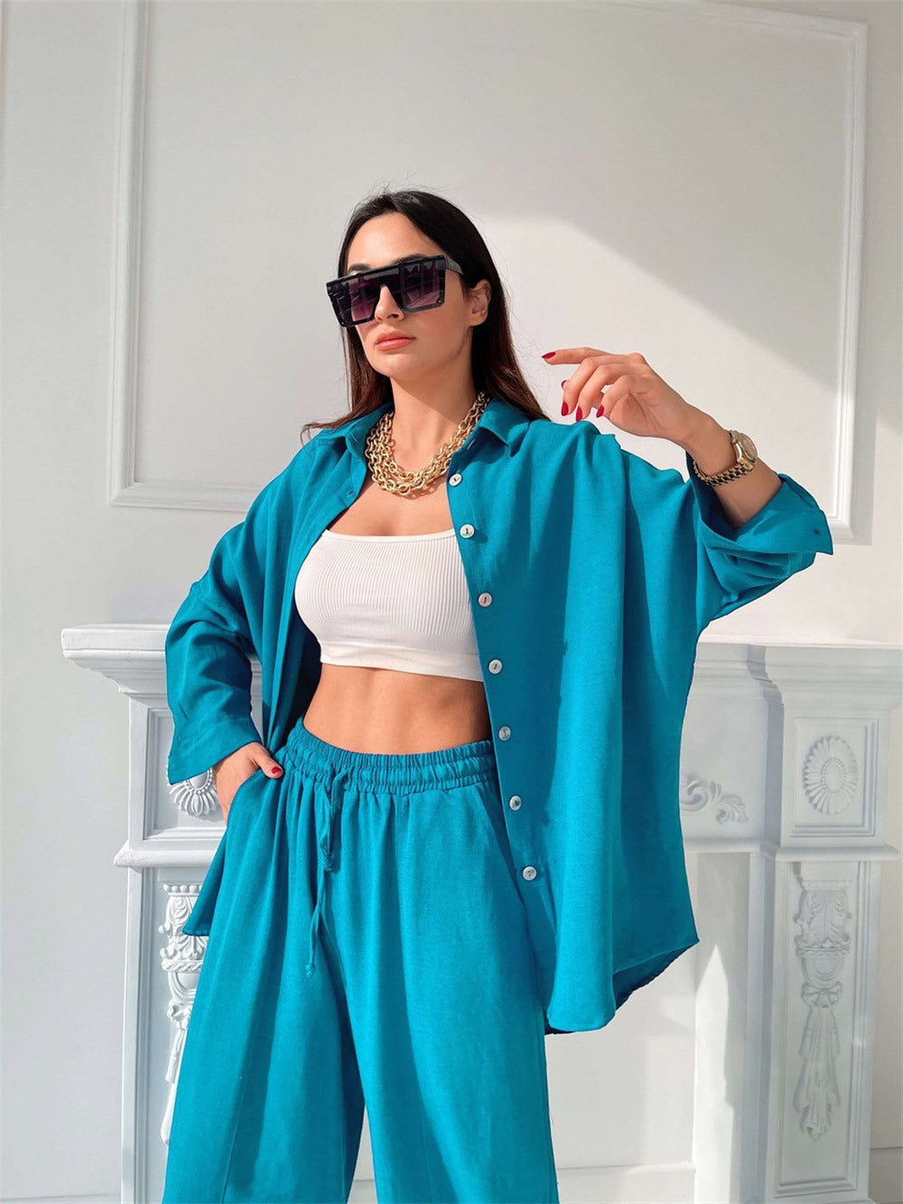 2022 spring new European and American cross-border casual suit solid color lapel long-sleeved shirt top harem pants two-piece set