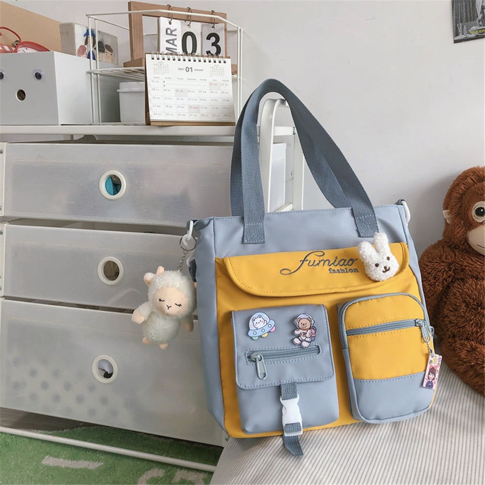 Gray and yellow bag with decorative elements on a dresser