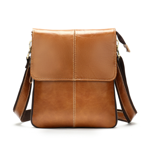 Brown leather crossbody bag on a white background