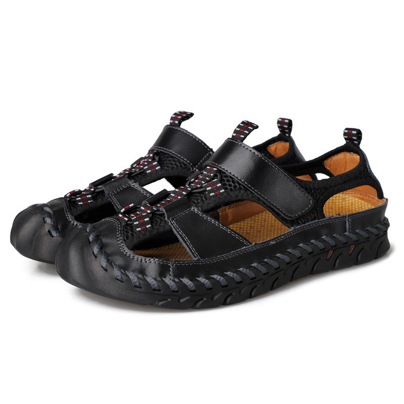 Black sandals with woven design on a white background