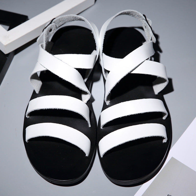 Black and white sandals on a gray background