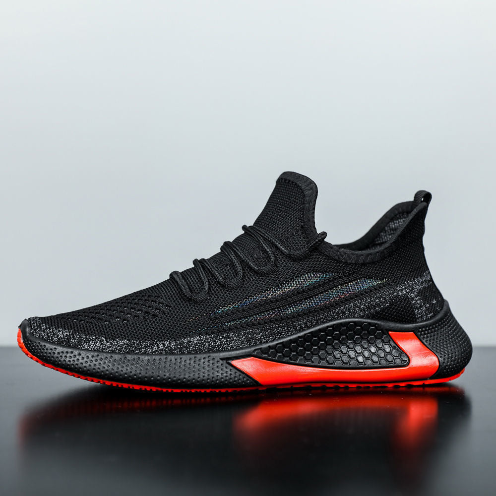 Black and red sneaker on a reflective surface with a gray background