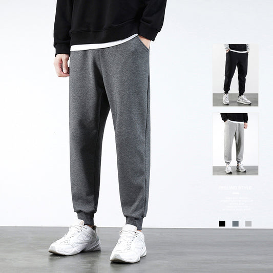 Spring and autumn cotton casual sports trousers men's thin Korean version of the trend Slim small foot running stepwise straight pants